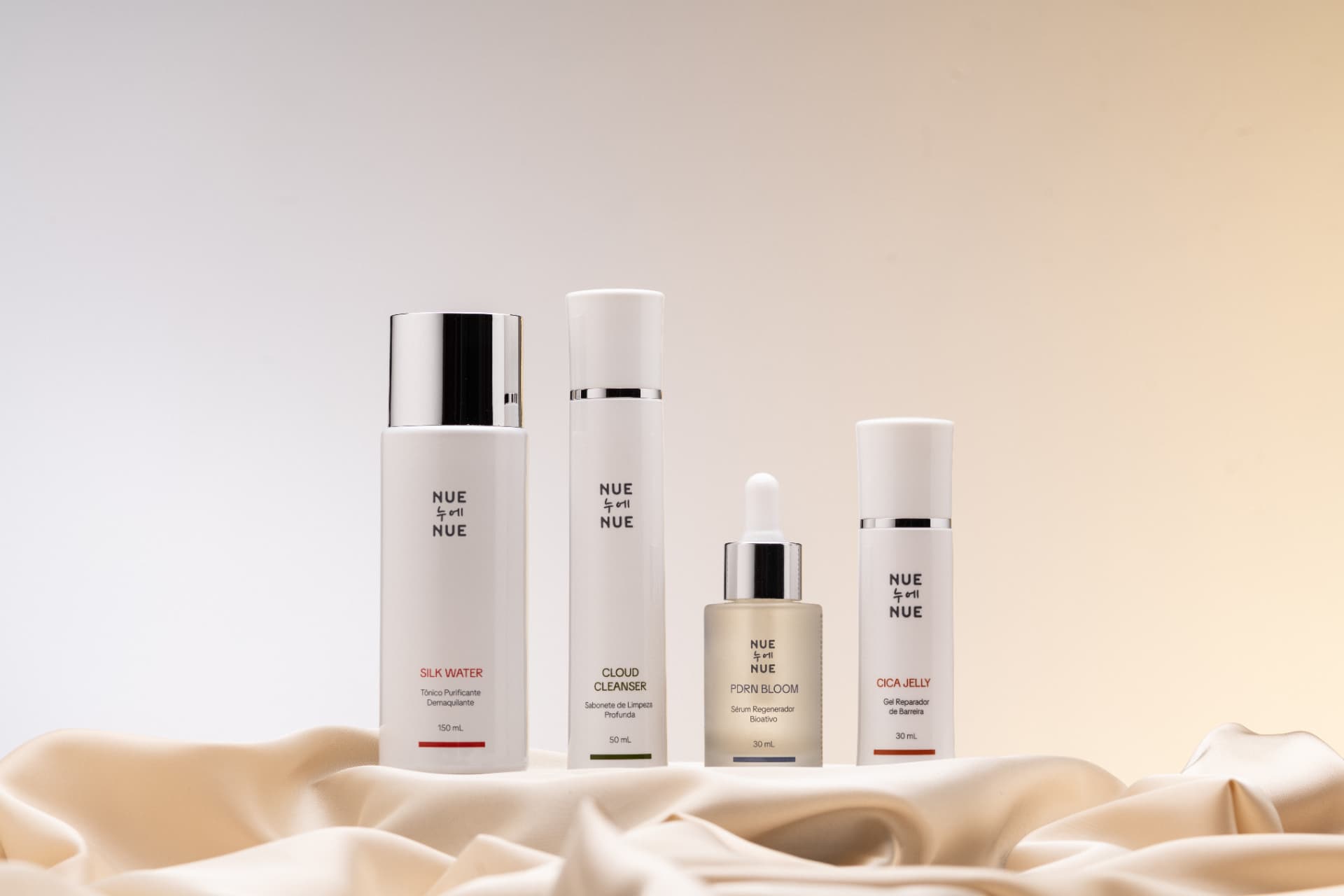 NUE NUE — linha completa de produtos sobre seda